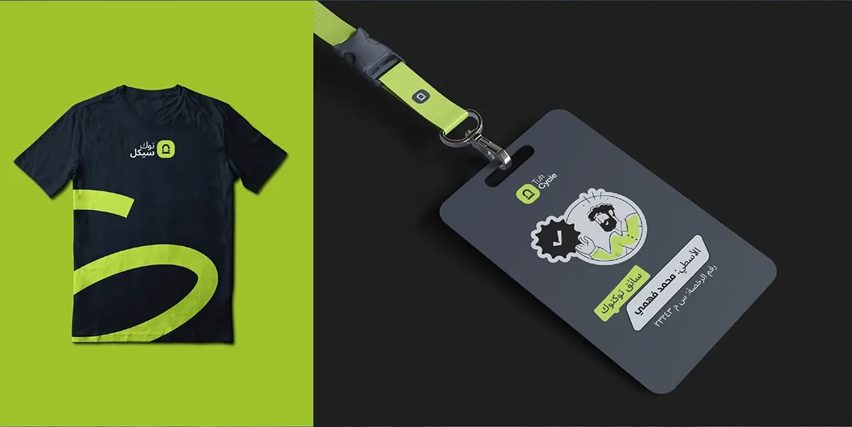 A navy Tukcycle T-shirt and a captain ID badge with photo, name and licence number